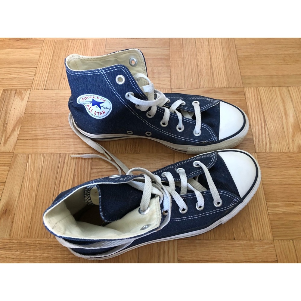 Blue high top converse shoes